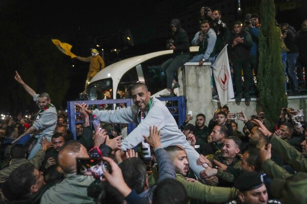zaharia zubeidi , former leader of the al-aqsa martyrs brigade, an armed offshoot of the secular fatah party, center, is greeted upon his arrival after being released from an israeli prison in the west bank city of ramallah, thursday jan. 30, 2025.(ap photo/nasser nasser)