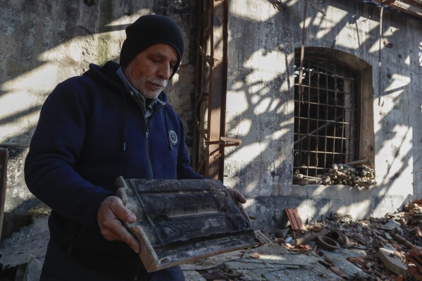 train operator mazen malla inspects the qadam train station, which was damaged during the war between rebel forces and ousted president bashar assad's forces, in damascus, syria, monday, jan. 13, 2025. (ap photo/omar sanadiki)