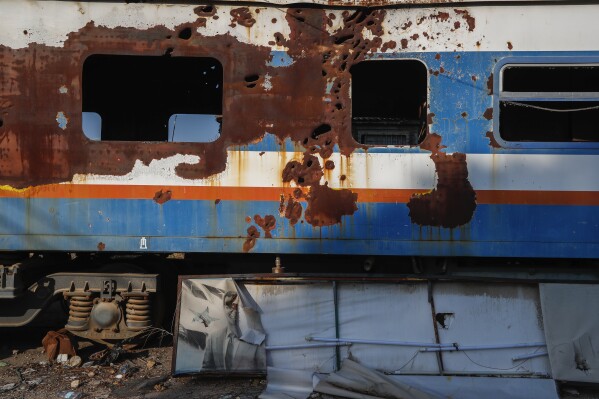 an abandoned train carriage is seen at the qadam train station, which was damaged during the war between rebel forces and ousted president bashar assad's forces, in damascus, syria, monday, jan. 13, 2025. (ap photo/omar sanadiki)
